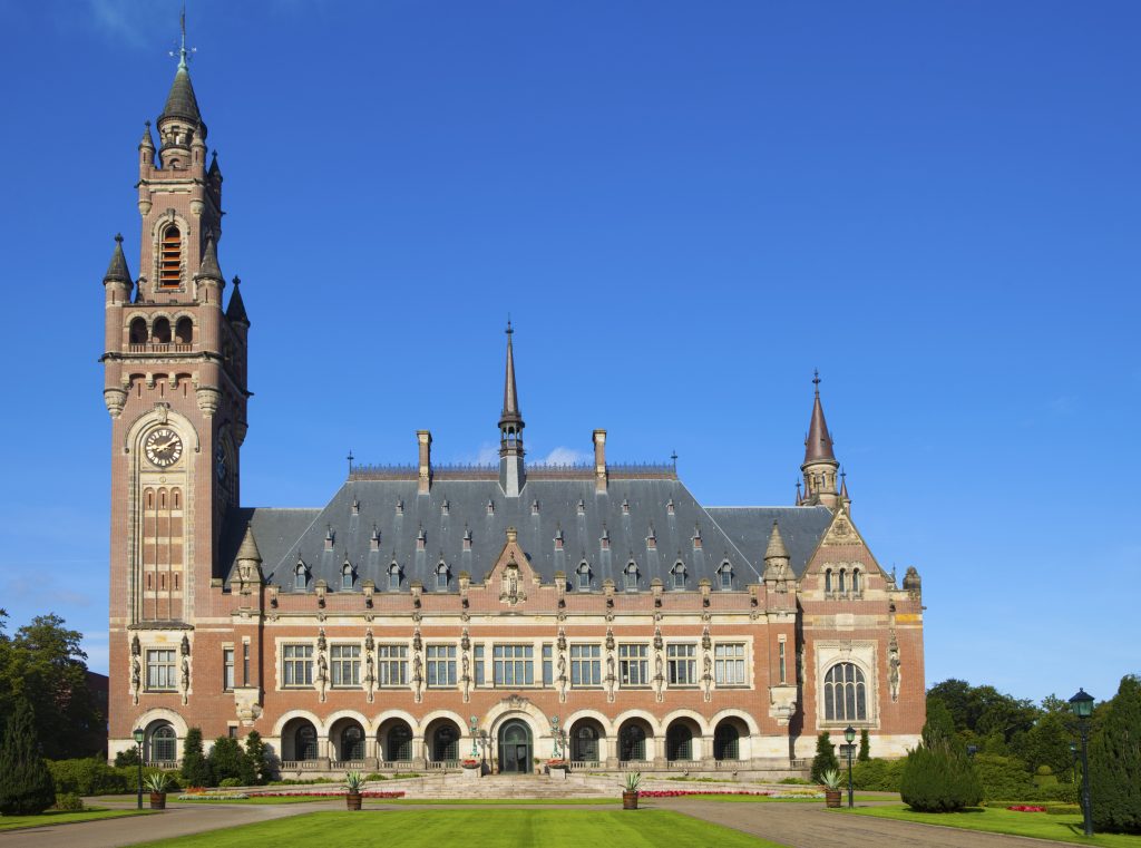 exterior of The Hague's Peace Palace against a blue sky